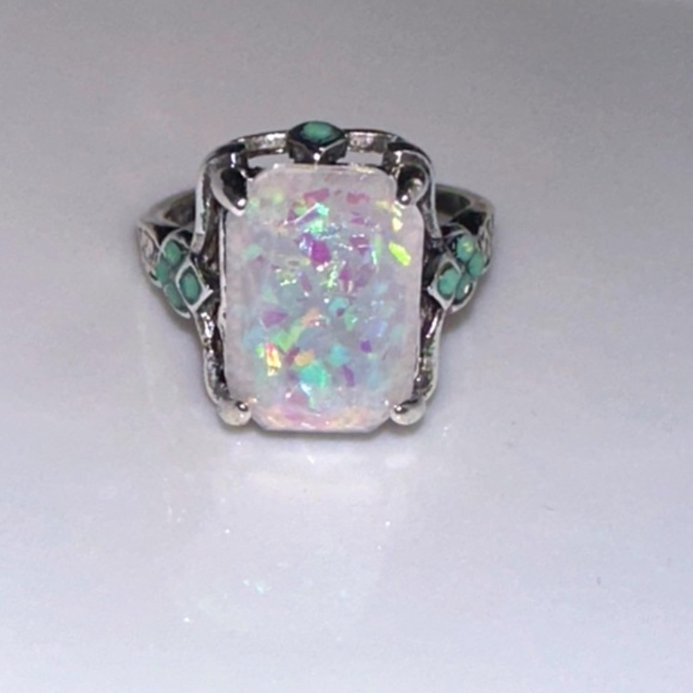 Lab opal ornamental ring. 4.25 carats. With turquoise accents